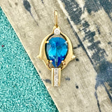 14k Yellow Gold Double Dolphins With Pear Shape Blue Topaz And .50cttw Diamonds Pendant